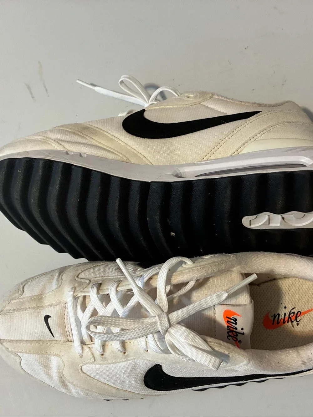 Nike Air Max Dawn sneakers in a White/Total Orange/Black colorway